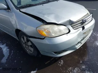 2004 Toyota Corolla CE with VIN 1NXBR38E34Z277929, listed as a IAAI auction lot 41807213 with 197,757 mi miles. Bid and sale history available at carsss.com. Image 6.