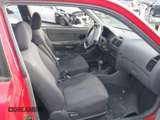 2003 Hyundai Accent GL with VIN KMHCG35C23U238969, listed as a IAAI auction lot 41462884 with 156,682 mi miles. Bid and sale history available at carsss.com. Image 5.