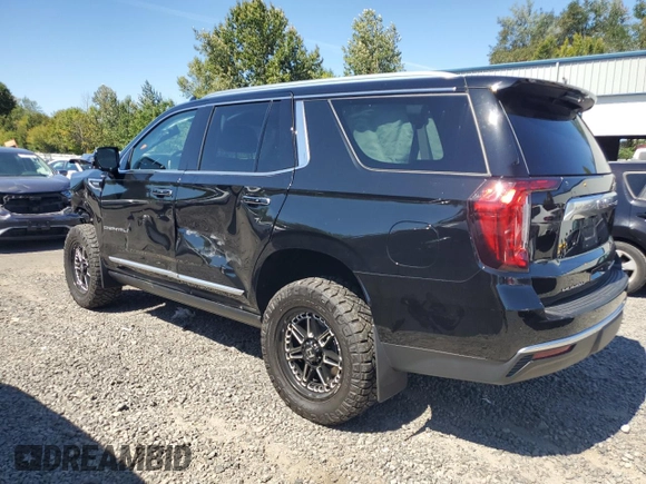 2023 GMC Yukon Denali with VIN 1GKS2DKT9PR158736, listed as a Copart auction lot 69765034 with 22,042 mi miles and Salvage Title. Bid and sale history available at carsss.com. Image 2.