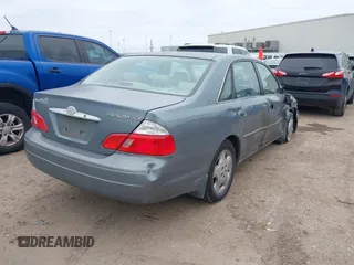 2004 Toyota Avalon XL with VIN 4T1BF28B84U370390, listed as a IAAI auction lot 41351151 with 242,910 mi miles and . Bid and sale history available at DreamBid. Image 4.