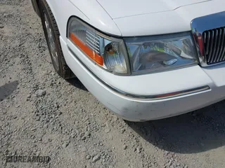 2003 Mercury Grand Marquis LS Premium with VIN 2MEFM75W33X669341, listed as a IAAI auction lot 42063018 with 124,047 mi miles. Bid and sale history available at carsss.com. Image 6.