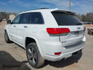 2014 Jeep Grand Cherokee Overland with VIN 1C4RJFCT6EC126897, listed as a IAAI auction lot 41826773 with 115,251 mi miles. Bid and sale history available at carsss.com. Image 3.