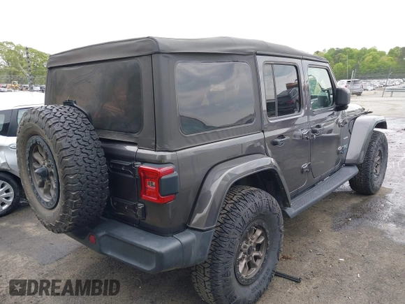 2021 Jeep Wrangler Unlimited Sahara with VIN 1C4JJXP60MW704738, listed as a IAAI auction lot 42042079 with 63,765 mi miles and . Bid and sale history available at DreamBid. Image 4.