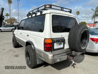 1997 Mitsubishi Montero z VIN JA4MR41R3VJ007919, wystawiony jako Copart lot #51544685 z przebiegiem 268 046 mil mil oraz Czysty tytuł • Clean title. Historia ofert i sprzedaży dostępna na DreamBid. Obrazek 3.