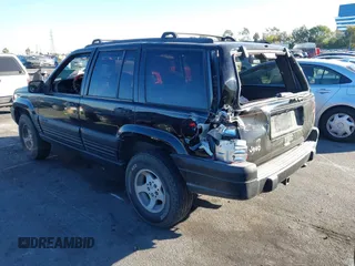 1998 Jeep Grand Cherokee Laredo with VIN 1J4FX58S8WC121904, listed as a IAAI auction lot 41145207 with 222,134 mi miles. Bid and sale history available at carsss.com. Image 3.