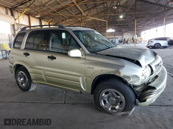 1999 Suzuki Grand Vitara JLX z VIN JS3TD62V3X4123048, wystawiony jako Copart lot #73007124 z przebiegiem 159 828 mil mil oraz Szkoda całkowita • Salvage title. Historia ofert i sprzedaży dostępna na DreamBid. Obrazek 4.