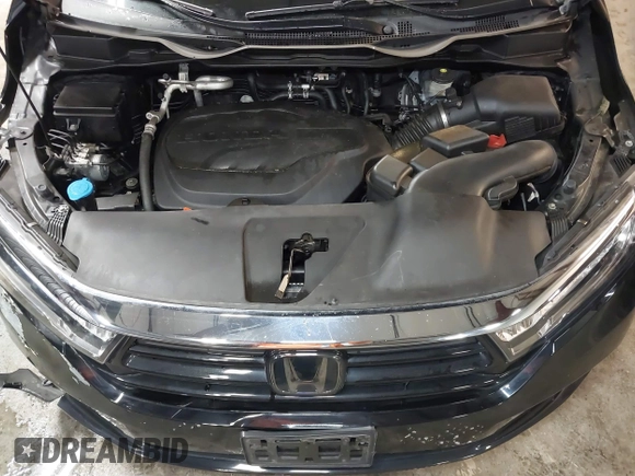 2021 Honda Odyssey Touring with VIN 5FNRL6H83MB040138, listed as a IAAI auction lot 39150096 with 61,322 mi miles and . Bid and sale history available at DreamBid. Image 10.