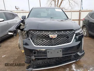 2021 Cadillac XT6 Premium Luxury z VIN 1GYKPDRS9MZ120150, wystawiony jako IAAI lot #41715368 z przebiegiem 47 835 mil mil oraz . Historia ofert i sprzedaży dostępna na DreamBid. Obrazek 13.