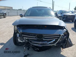 2020 Mazda CX-9 Grand Touring z VIN JM3TCADY8L0417775, wystawiony jako IAAI lot #42306864 z przebiegiem 35 287 mil mil oraz . Historia ofert i sprzedaży dostępna na DreamBid. Obrazek 13.