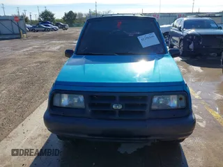 1997 Chevrolet Tracker z VIN 2CNBE1865V6904672, wystawiony jako IAAI lot #41296166 z przebiegiem 266 743 mil mil oraz . Historia ofert i sprzedaży dostępna na DreamBid. Obrazek 12.