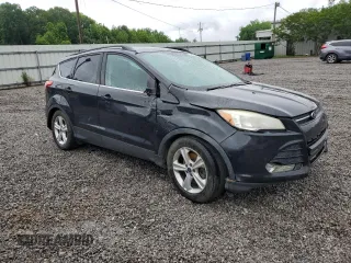 2014 Ford Escape SE with VIN 1FMCU9GX7EUB52765, listed as a Copart auction lot 57563305 with 187,203 mi miles and Salvage title. Bid and sale history available at DreamBid. Image 4.