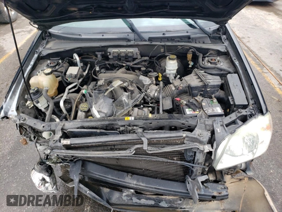 2005 Mazda Tribute S with VIN 4F2YZ04195KM65089, listed as a Copart auction lot 70993244 with Not Provided miles and Salvage Title. Bid and sale history available at DreamBid. Image 12.