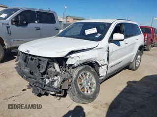 2018 Jeep Grand Cherokee Laredo E with VIN 1C4RJEAG2JC428990, listed as a IAAI auction lot 41218996 with 123,758 mi miles. Bid and sale history available at carsss.com. Image 2.