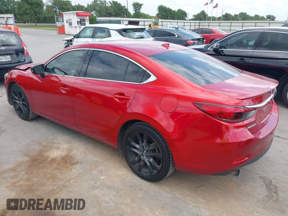 2016 Mazda 6 i Grand Touring z VIN JM1GJ1W58G1486694, wystawiony jako IAAI lot #42094443 z przebiegiem 77 803 mil mil oraz . Historia ofert i sprzedaży dostępna na DreamBid. Obrazek 3.