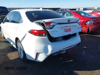 2023 Toyota Corolla Hybrid LE with VIN JTDBCMFE1PJ011085, listed as a IAAI auction lot 41340297 with 34,437 mi miles. Bid and sale history available at carsss.com. Image 6.