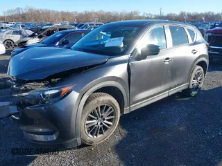 2021 Mazda CX-5 Touring with VIN JM3KFBCM8M1370640, listed as a IAAI auction lot 41207736 with 57,570 mi miles. Bid and sale history available at carsss.com. Image 18.