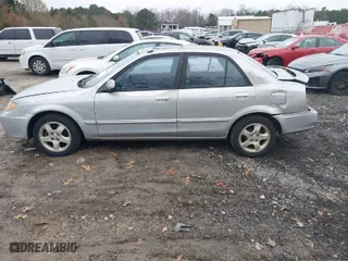 2002 Mazda Protege DX with VIN JM1BJ225920515625, listed as a IAAI auction lot 41144290 with 230,434 mi miles. Bid and sale history available at carsss.com. Image 14.
