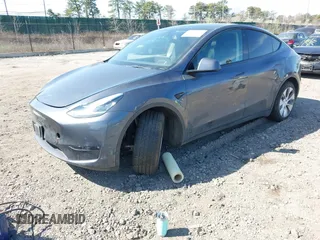 2022 Tesla Model Y Long Range with VIN 7SAYGDEE2NF460945, listed as a IAAI auction lot 41921645 with 62,318 mi miles and . Bid and sale history available at DreamBid. Image 2.