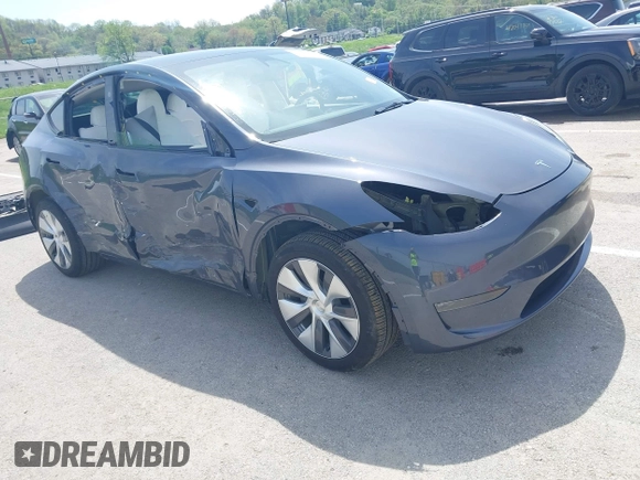 2023 Tesla Model Y Long Range z VIN 7SAYGDEE1PA158661, wystawiony jako IAAI lot #41983897 z przebiegiem 20 176 mil mil oraz . Historia ofert i sprzedaży dostępna na DreamBid. Obrazek 1.