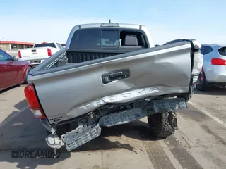 2018 Toyota Tacoma SR5 with VIN 3TMAZ5CN0JM053861, listed as a IAAI auction lot 41920377 with 104,015 mi miles and . Bid and sale history available at DreamBid. Image 16.