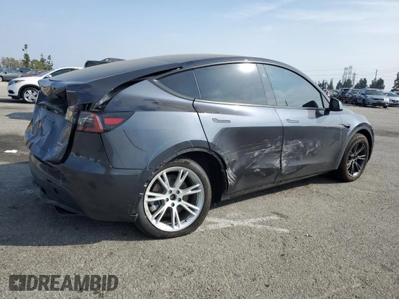 2024 Tesla Model Y Long Range with VIN 7SAYGDEE2RA244242, listed as a Copart auction lot 52635095 with 4,994 mi miles and Salvage title. Bid and sale history available at DreamBid. Image 3.