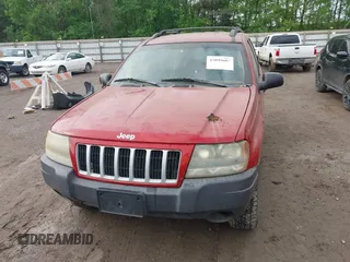2004 Jeep Grand Cherokee Laredo with VIN 1J4GW48S64C371253, listed as a IAAI auction lot 42099607 with 260,618 mi miles. Bid and sale history available at carsss.com. Image 6.