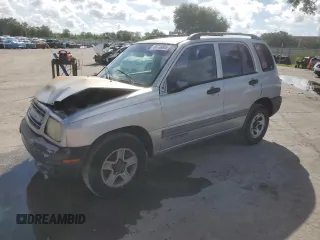 2003 Chevrolet Tracker z VIN 2CNBE13C836953178, wystawiony jako Copart lot #60715605 z przebiegiem 128 978 mil mil oraz Szkoda całkowita • Salvage title. Historia ofert i sprzedaży dostępna na DreamBid. Obrazek 1.