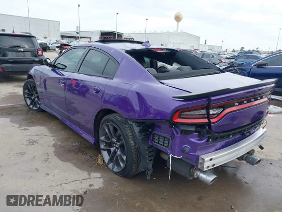 2023 Dodge Charger Scat Pack Widebody with VIN 2C3CDXGJ5PH699595, listed as a IAAI auction lot 41303894 with 1,828 mi miles and . Bid and sale history available at DreamBid. Image 3.