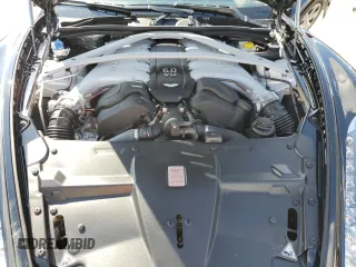 2015 Aston Martin DB9 z VIN SCFFDAFM3FGB16585, wystawiony jako Copart lot #76159354 z przebiegiem Nie podano mil oraz Szkody całkowita. Historia ofert i sprzedaży dostępna na DreamBid. Obrazek 11.