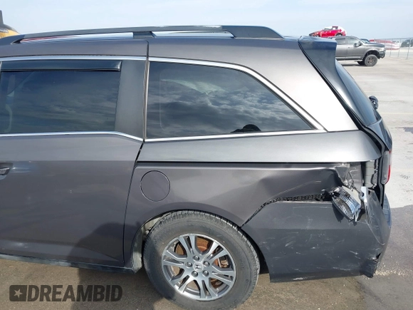 2012 Honda Odyssey EX-L with VIN 5FNRL5H60CB094682, listed as a IAAI auction lot 41570797 with 127,890 mi miles and . Bid and sale history available at carsss.com. Image 18.