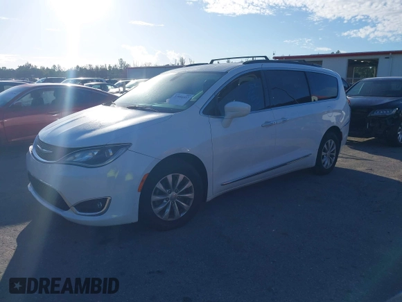 2017 Chrysler Pacifica Touring L with VIN 2C4RC1BG2HR526503, listed as a IAAI auction lot 40264571 with 136,262 mi miles and . Bid and sale history available at DreamBid. Image 2.