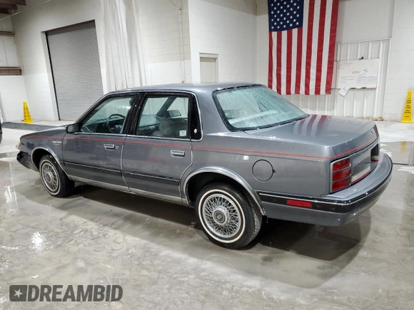 1991 Oldsmobile Cutlass Ciera with VIN 2G3AM54N8M2304905, listed as a Copart auction lot 52047535 with 28,749 mi miles and Salvage Title. Bid and sale history available at DreamBid. Image 2.