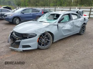2022 Dodge Charger SXT with VIN 2C3CDXBGXNH145896, listed as a IAAI auction lot 42010378 with 24,561 mi miles and . Bid and sale history available at DreamBid. Image 2.