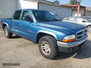 2002 Dodge Dakota SLT with VIN 1B7HL48N82S658321, listed as a IAAI auction lot 41506738 with 252,950 mi miles. Bid and sale history available at carsss.com. Image 1.