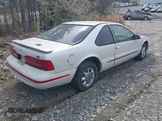 1997 Ford Thunderbird LX with VIN 1FALP62W6VH142784, listed as a IAAI auction lot 41792883 with 244,300 mi miles. Bid and sale history available at carsss.com. Image 4.