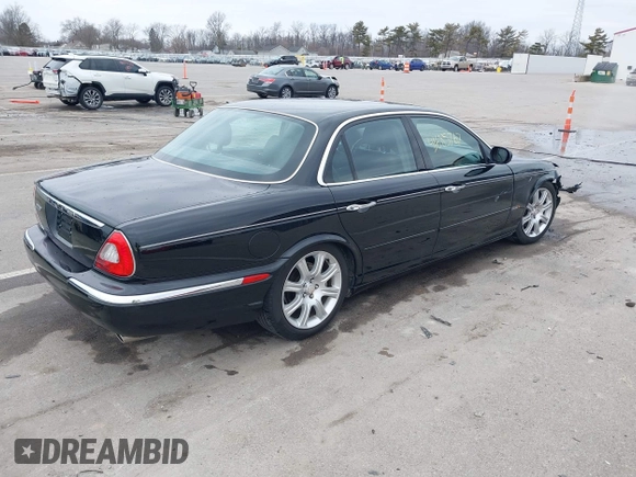2004 Jaguar XJ with VIN SAJWA71C14SG20122, listed as a IAAI auction lot 41685767 with 113,392 mi miles. Bid and sale history available at carsss.com. Image 4.