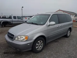 2004 Kia Sedona LX with VIN KNDUP131546535352, listed as a IAAI auction lot 41856784 with 128,943 mi miles. Bid and sale history available at carsss.com. Image 2.