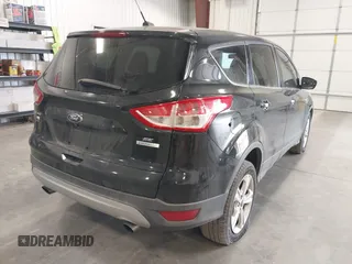 2014 Ford Escape SE with VIN 1FMCU0GX3EUA76540, listed as a IAAI auction lot 41905890 with 233,720 mi miles. Bid and sale history available at carsss.com. Image 4.