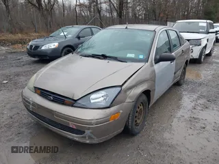2003 Ford Focus LX with VIN 1FAFP33P33W267575, listed as a IAAI auction lot 41804406 with 106,957 mi miles and . Bid and sale history available at carsss.com. Image 6.