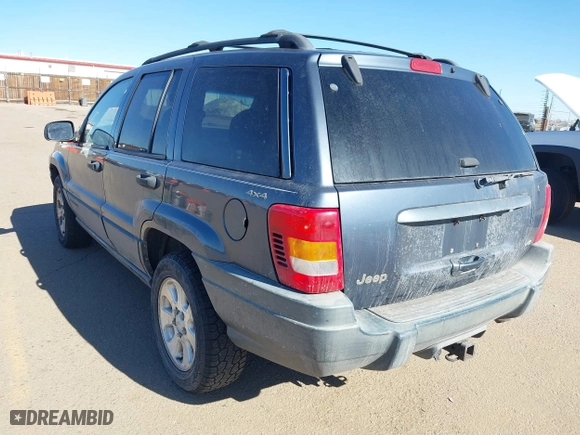 2001 Jeep Grand Cherokee Laredo with VIN 1J4GW48N11C558857, listed as a IAAI auction lot 41527331 with 187,513 mi miles. Bid and sale history available at carsss.com. Image 3.