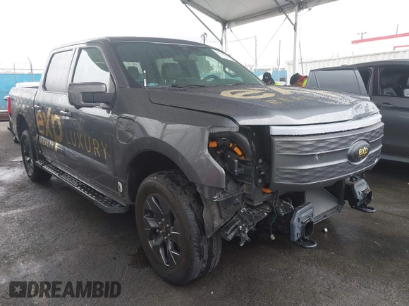 2022 Ford F-150 Lightning Pro z VIN 1FTVW1EL8NWG14070, wystawiony jako IAAI lot #41776980 z przebiegiem 14 812 mil mil oraz . Historia ofert i sprzedaży dostępna na DreamBid. Obrazek 1.