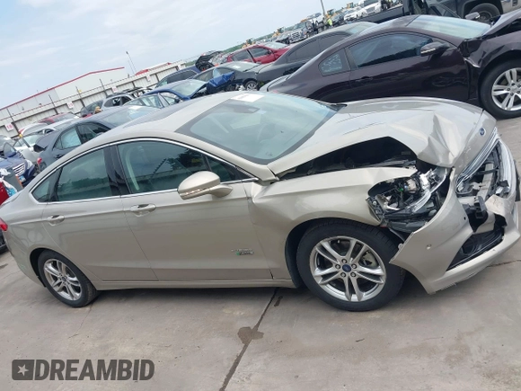 2015 Ford Fusion Energi Titanium with VIN 3FA6P0SU3FR114739, listed as a IAAI auction lot 42003011 with 120,553 mi miles. Bid and sale history available at carsss.com. Image 13.