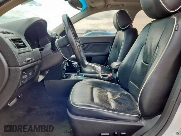 2012 Ford Fusion SEL with VIN 3FAHP0JG0CR395673, listed as a Copart auction lot 57904135 with 169,886 mi miles and Salvage title. Bid and sale history available at DreamBid. Image 7.
