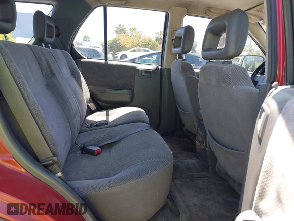 1999 Isuzu Rodeo S z VIN 4S2CK58W4X4362837, wystawiony jako IAAI lot #42403621 z przebiegiem 177 690 mil mil oraz . Historia ofert i sprzedaży dostępna na DreamBid. Obrazek 8.