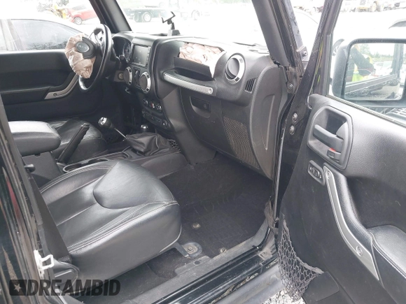 2015 Jeep Wrangler Unlimited Rubicon Hard Rock with VIN 1C4HJWFG6FL757421, listed as a IAAI auction lot 42107514 with 63,997 mi miles and . Bid and sale history available at DreamBid. Image 5.