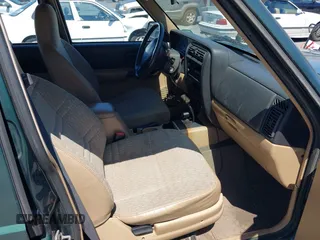 1999 Jeep Cherokee Sport with VIN 1J4FF68S0XL640066, listed as a IAAI auction lot 42768166 with 196,290 mi miles and . Bid and sale history available at DreamBid. Image 5.