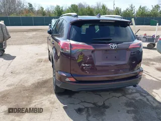 2016 Toyota RAV4 LE with VIN 2T3ZFREV8GW310580, listed as a IAAI auction lot 42063071 with 104,099 mi miles and . Bid and sale history available at DreamBid. Image 3.