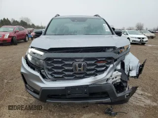 2023 Honda Passport TrailSport with VIN 5FNYF8H64PB044233, listed as a Copart auction lot 53522015 with 10,458 mi miles and Salvage title. Bid and sale history available at DreamBid. Image 5.