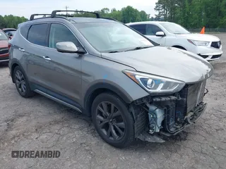2018 Hyundai Santa Fe Ultimate z VIN 5XYZW4LA4JG527567, wystawiony jako IAAI lot #42108160 z przebiegiem 106 616 mil mil oraz . Historia ofert i sprzedaży dostępna na DreamBid. Obrazek 1.