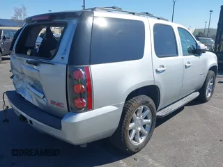 2013 GMC Yukon SLT with VIN 1GKS1CE07DR157076, listed as a IAAI auction lot 41557228 with 148,242 mi miles. Bid and sale history available at carsss.com. Image 4.